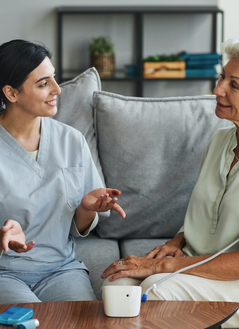 young-nurse-talking-to-senior-woman-in-retirement-home.jpg
